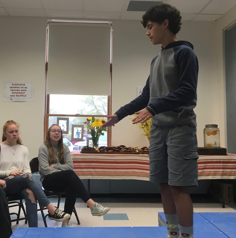 8th grade student telling a Moth-style story to an audience